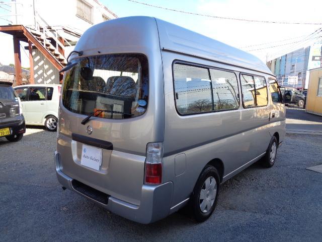 キャラバン 2400ccKA24ノンターボガソリンエンジン 10人乗り送迎車両 デュアルエアコン ABS リクライニングモケットシート カセット 時計 ホイールキャップ ハイルーフ ETC センタードアロック(4枚目)