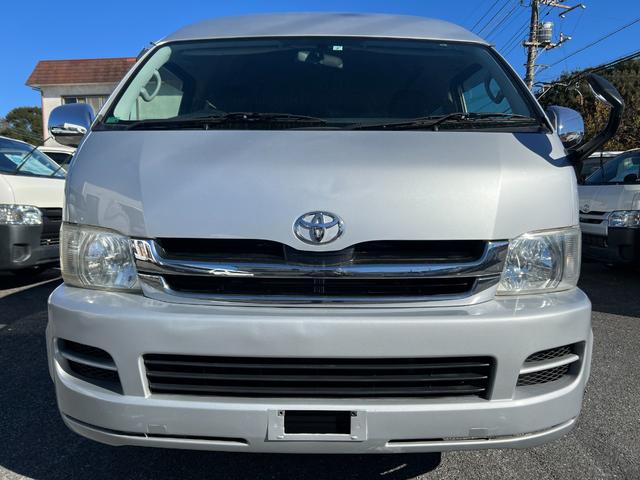 ハイエースワゴン グランドキャビン 純正ナビTVバックカメラETCキーレスリヤクーラーヒーター電動スライドドア電動格納ミラーシートカバーオートライトオートエアコンWエアバック(3枚目)