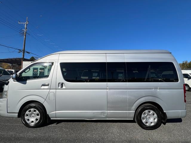 ハイエースワゴン グランドキャビン 純正ナビTVバックカメラETCキーレスリヤクーラーヒーター電動スライドドア電動格納ミラーシートカバーオートライトオートエアコンWエアバック(5枚目)