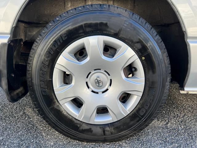 ハイエースワゴン グランドキャビン 純正ナビTVバックカメラETCキーレスリヤクーラーヒーター電動スライドドア電動格納ミラーシートカバーオートライトオートエアコンWエアバック(11枚目)