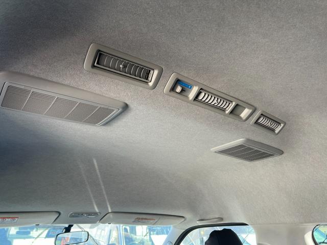 ハイエースワゴン グランドキャビン 純正ナビTVバックカメラETCキーレスリヤクーラーヒーター電動スライドドア電動格納ミラーシートカバーオートライトオートエアコンWエアバック(35枚目)