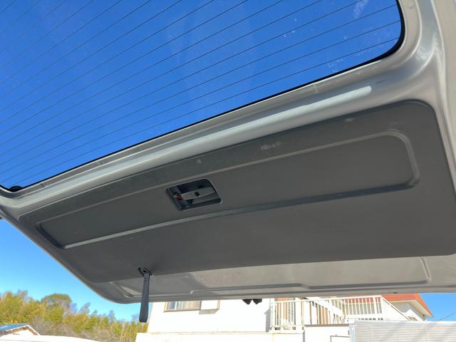 ハイエースワゴン グランドキャビン 純正ナビTVバックカメラETCキーレスリヤクーラーヒーター電動スライドドア電動格納ミラーシートカバーオートライトオートエアコンWエアバック(38枚目)