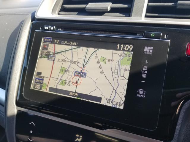 フィットハイブリッド Fパッケージ ナビ ワンセグ Bカメラ Bluetoothオーディオ ETC スマキー 禁煙車 フルフラット 横滑り防止 ABS 電格ミラー CD DVD再生 運転席エアバッグ 助手席エアバッグ エアコン(4枚目)