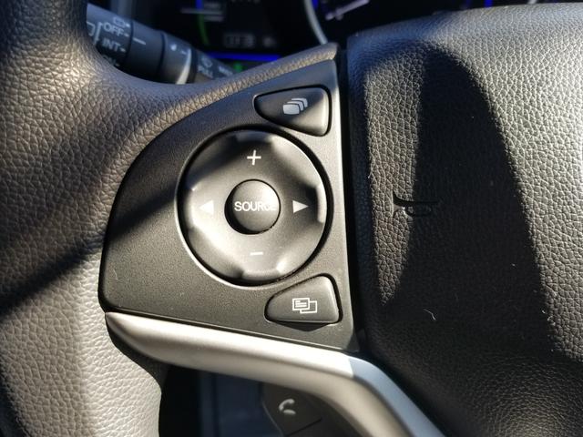 フィットハイブリッド Fパッケージ ナビ ワンセグ Bカメラ Bluetoothオーディオ ETC スマキー 禁煙車 フルフラット 横滑り防止 ABS 電格ミラー CD DVD再生 運転席エアバッグ 助手席エアバッグ エアコン(33枚目)