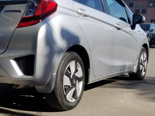 フィットハイブリッド Fパッケージ ナビ ワンセグ Bカメラ Bluetoothオーディオ ETC スマキー 禁煙車 フルフラット 横滑り防止 ABS 電格ミラー CD DVD再生 運転席エアバッグ 助手席エアバッグ エアコン(53枚目)