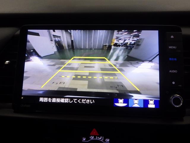 フィット ｅ：ＨＥＶホーム　元当社試乗車　禁煙　前ドライブレコーダー　ホンダコネクト９インチナビ　リアカメラ　前ドライブレコーダー　サイドカーテンエアバッグ　ＥＴＣ　Ｂｌｕｅｔｏｏｔｈ接続　ＣＤ　ＤＶＤ　ミュージックラック（3枚目）