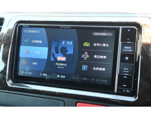 GL ロング Ver5内装架装フルフラット対面座席フローリング施工1.5インチローダウンリップスポイラーオーバーフェンダーLEDテール煌アーバングランデ17インチAWナスカータイヤシートカバーカロッツェリアSDナビ(32枚目)