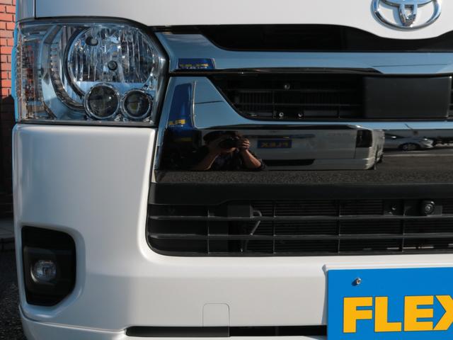 ハイエースバン スーパーＧＬ　ダークプライムＩＩ　ディーゼル４ＷＤ床張り跳ね上げベット　純正フルセグナビ　カロッツェリアツイーター　スモークフィルム　ＴＲＤフロントスポイラー　ＴＲＤサイドスカート　ＴＲＤリアバンパースポイラー　ＴＲＤスカッフプレート（24枚目）