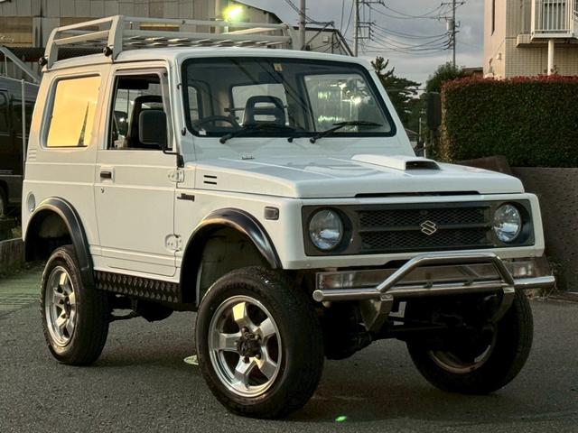 ジムニー ＨＣ　タイベル交換済　記録簿　エアコン　パワステ　リフトアップ　前後社外バンパー　社外１６インチアルミホイール　ルーフキャリア　シートカバー　４人乗り（3枚目）