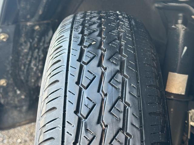 ＮＶ１００クリッパーバン ＧＸ　２０２４年製造タイヤ　キーレス　パワーウィンドウ　エアコン　パワステ　リビルト品オルタネーター　積載量３５０ｋｇ　修復歴無し　軽貨物　軽バン　４ナンバー　４人乗り　フルフラットシート　ハイルーフ（10枚目）