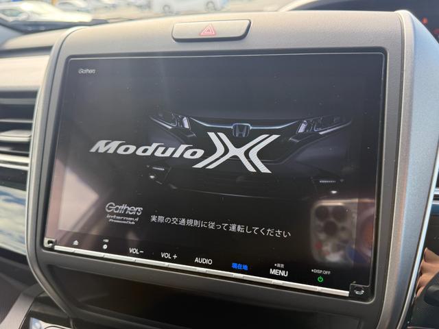 フリードハイブリッド ハイブリッド・モデューロX ホンダセンシング 6人乗り 禁煙1オーナー車 純正9型ナビ 両側電動スライド バックカメラ ETC2.0 衝突軽減装置 車線逸脱警報 Bluetoothオーディオ フルセグTV DVD再生 ハーフレザー 追従クルコン(7枚目)
