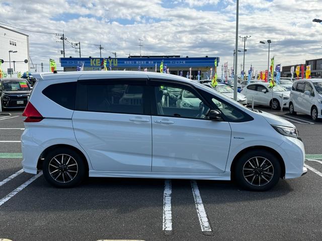 フリードハイブリッド ハイブリッド・モデューロX ホンダセンシング 6人乗り 禁煙1オーナー車 純正9型ナビ 両側電動スライド バックカメラ ETC2.0 衝突軽減装置 車線逸脱警報 Bluetoothオーディオ フルセグTV DVD再生 ハーフレザー 追従クルコン(21枚目)