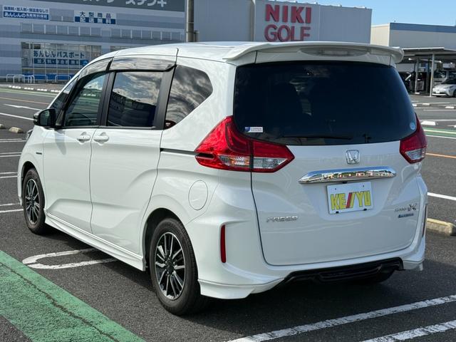 フリードハイブリッド ハイブリッド・モデューロX ホンダセンシング 6人乗り 禁煙1オーナー車 純正9型ナビ 両側電動スライド バックカメラ ETC2.0 衝突軽減装置 車線逸脱警報 Bluetoothオーディオ フルセグTV DVD再生 ハーフレザー 追従クルコン(23枚目)