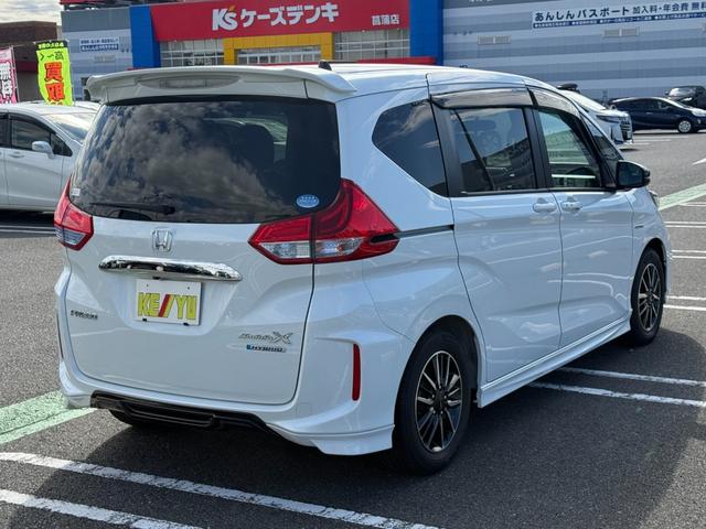 フリードハイブリッド ハイブリッド・モデューロX ホンダセンシング 6人乗り 禁煙1オーナー車 純正9型ナビ 両側電動スライド バックカメラ ETC2.0 衝突軽減装置 車線逸脱警報 Bluetoothオーディオ フルセグTV DVD再生 ハーフレザー 追従クルコン(25枚目)
