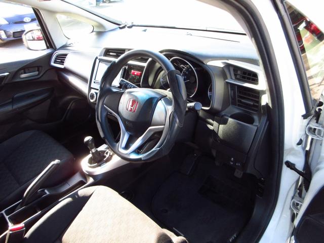 フィット 13G・Fパッケージ 5速マニュアル ナビ ブルートゥース ETC Bカメラ 前後ドライブレコーダー スマートキー アイストップ 社外アルミ CTBA ドアバイザー プライバシーガラス カーテンエアバッグ 保証書(13枚目)