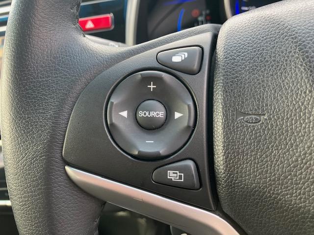 フィットハイブリッド Ｌパッケージ　４ＷＤ　オートクルーズ　ハーフレザー　ナビ　フルセグ　Ｂカメラ　Ｂｌｕｅｔｏｏｔｈオーディオ　ＥＴＣ　Ｉストップ　ＬＥＤヘッドライト　１５インチＡＷ　スマキー　禁煙車　横滑り防止　ＡＢＳ　電格ミラー（25枚目）