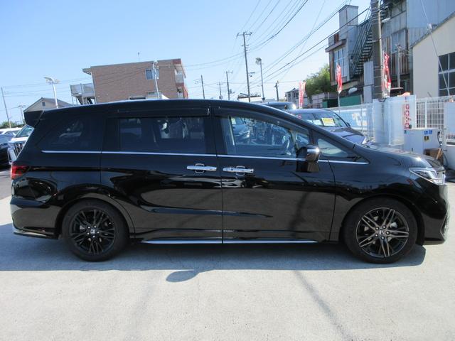 オデッセイハイブリッド e:HEVアブソルート・EX ホンダセンシング レザーシート 純正10インチナビ フルセグTV 後席フリップダウンモニター 全周囲カメラ パワーバックドア 両側パワースライドドア ドラレコ ETC シートヒーター パワーシート(13枚目)