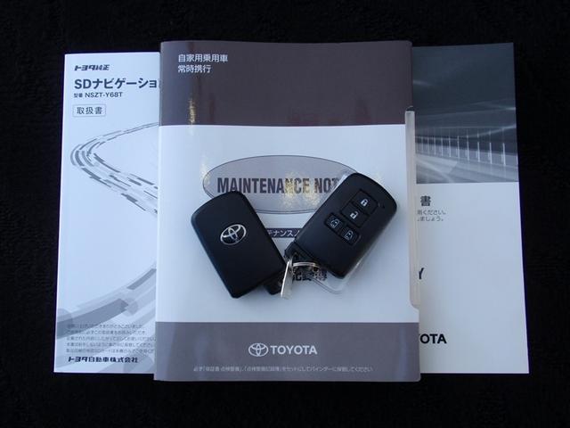 ヴォクシー ＺＳ　煌ＩＩ　記録簿付き　後カメラ　キーレスエントリー　地デジ　デュアルエアコン　横滑防止装置　クルーズＣ　１オナ車　助手席エアバック　アルミホイール　ＥＴＣ装備　ＴＶナビ　ＡＣ　パワーステアリング　三列シート（18枚目）
