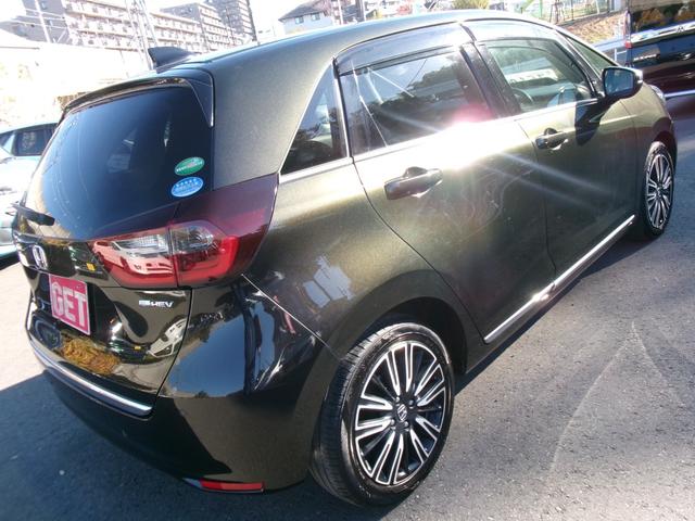 フィット ｅ：ＨＥＶリュクス　禁煙車　純正ナビ　バックカメラ　Ｂｌｕｅｔｏｏｔｈ　ＤＶＤ再生　ＵＳＢ　純正前後ドラレコ　ステコン　ＥＴＣ　ワイヤレススマホ充電　ホンダセンシング　レザーシート　シートヒーター　スマートキー（9枚目）