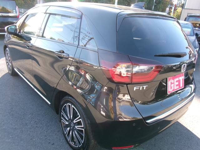 フィット ｅ：ＨＥＶリュクス　禁煙車　純正ナビ　バックカメラ　Ｂｌｕｅｔｏｏｔｈ　ＤＶＤ再生　ＵＳＢ　純正前後ドラレコ　ステコン　ＥＴＣ　ワイヤレススマホ充電　ホンダセンシング　レザーシート　シートヒーター　スマートキー（11枚目）