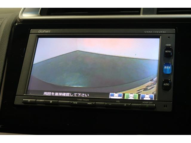 フィットハイブリッド Ｆパッケージコンフォートエディション　認定中古車　ナビ　Ｂカメラ　ＥＴＣ　シートヒーター　ワンオーナー　地デジフルセグ　セキュリティアラーム　ＡＵＴＯエアコン　スマートキー　バックカメラ　横滑り防止　助手席エアバッグ　ＤＶＤ再生　キーレス（11枚目）