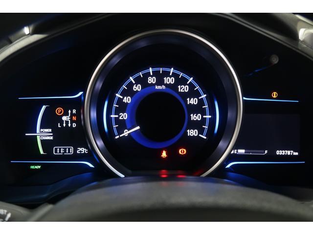 フィットハイブリッド Ｆパッケージコンフォートエディション　認定中古車　ナビ　Ｂカメラ　ＥＴＣ　シートヒーター　ワンオーナー　地デジフルセグ　セキュリティアラーム　ＡＵＴＯエアコン　スマートキー　バックカメラ　横滑り防止　助手席エアバッグ　ＤＶＤ再生　キーレス（13枚目）