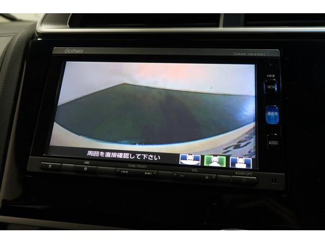フィットハイブリッド Lパッケージ 認定中古車 1年保証付 ワンオーナー ナビ Bカメラ 運転支援 1オーナ 電動格納式ミラー AUTOライト 半革 地デジフルセグTV サイドエアバック ミュージックプレイヤー接続可 DVD再生 LED(8枚目)