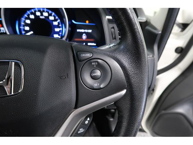 フィットハイブリッド Lパッケージ 認定中古車 1年保証付 ワンオーナー ナビ Bカメラ 運転支援 1オーナ 電動格納式ミラー AUTOライト 半革 地デジフルセグTV サイドエアバック ミュージックプレイヤー接続可 DVD再生 LED(12枚目)