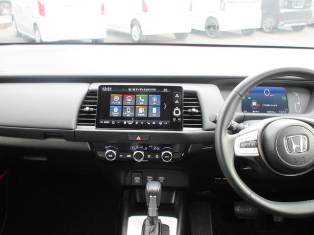 フィット ｅ：ＨＥＶクロスター　ホンダ認定中古車２年保証　当社デモカー　ドライブレコーダー　メモリーナビ　Ｂｌｕｅｔｏｏｔｈ　バックカメラ　ＥＴＣ２．０車載器　障害物センサー　スマートキー　セキュリティーアラーム　ハーフレザーシート（7枚目）