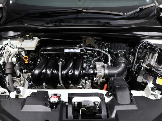 ヴェゼル ハイブリッドＲＳ・ホンダセンシング　禁煙車　運転支援機能　衝突軽減ブレーキ　ＬＥＤヘッドライト　パフォーマンスダンパー　ＥＴＣ　純正８インチナビ　バックカメラ　Ｂｌｕｅｔｏｏｔｈ接続　ドライブレコーダー　シートヒーター　サイドＳＲＳ（18枚目）