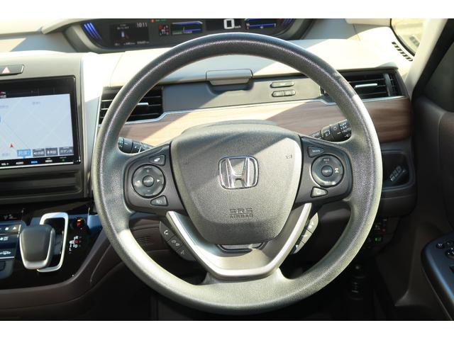 フリードハイブリッド ハイブリッド・Gホンダセンシング キーフリーシステム 後カメラ 地デジフルセグTV パワーウインドウ ETC付 ナビTV パワステ オートエアコン ABS スマキ- 両Pスラドア 軽減ブレーキ 1オ-ナ- 記録簿 DVD再生可能 禁煙(29枚目)