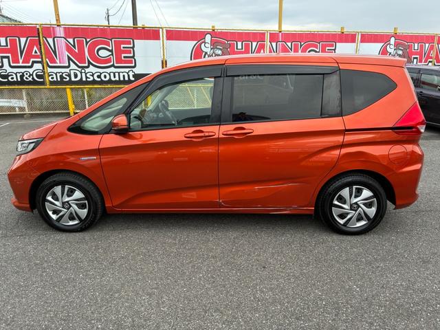 フリードハイブリッド ハイブリッド・Gホンダセンシング ETC スマートキー 両側パワースライドドア LEDヘッドランプ オートライト シートヒーター 純正メモリーナビ CD DVD再生 Bluetooth接続 バックカメラ ドライブレコーダー(11枚目)