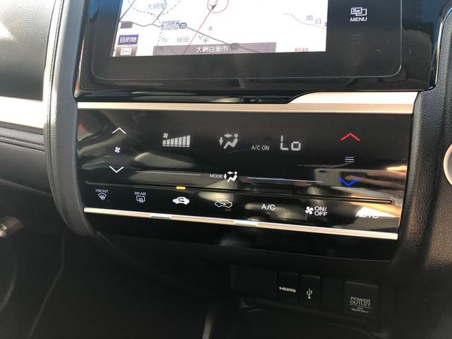 フィットハイブリッド Ｌパッケージ　メモリーナビ　ＣＤ　ＤＶＤ　Ｂｌｕｅｔｏｏｔｈ　電動格納ミラー　ＥＴＣ　クルーズコントロール　オートライト　ＬＥＤヘッドライト　アイドリングストップ　ハーフレザーシート　横滑り防止　スマートキー（38枚目）