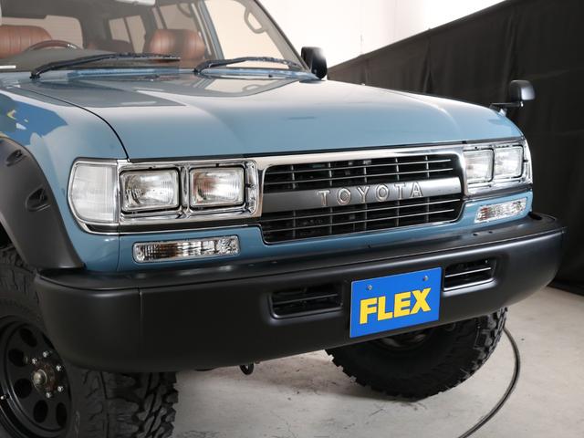 ランドクルーザー80 VXリミテッド VXリミテッドグレード スモーキーブルーペイント ブッシュワーカー風オーバーフェンダー 輸出用角目4灯ヘッドライト 新品ジオランダーMTタイヤ 新品ジムラインAW 新品ブラウンクラシックシートカバー(24枚目)