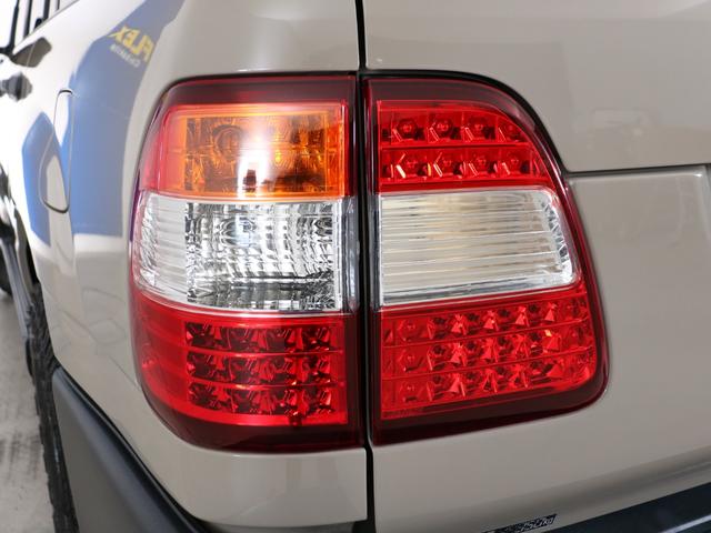 ランドクルーザー100 VXリミテッド Gセレクション ベージュカラーペイント 丸目ヘッドライト 横文字トヨタグリル 鉄チンホイール ARBフラックラック マルチレス HDDサイバーナビ バックカメラ ETC レザー調コンビシートカバー ウッドステアリング(34枚目)