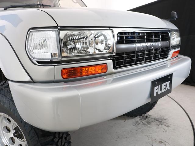 ランドクルーザー８０ 　下取り車　ハイリフト　後期型　新品ジオＭＴタイヤ　社外１６インチＡＷ　カロッツェリア製７インチナビ　ＥＴＣ　ウッドシフトノブ　ウッドステアリング　新品フロントグリル　新品３色テールランプ　サンルーフ（25枚目）