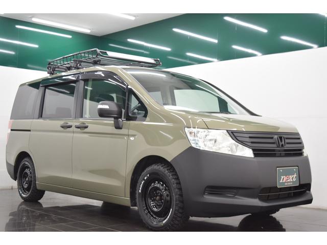 ステップワゴン Ｇ　Ｌパッケージ　地デジナビ　バックカメラ　後席モニター　フルフラット　ＭＴタイヤ　ルーフラック　ＥＴＣ　ＨＩＤ　オートライト　オートエアコン　ブラックアウトホイール　フローリングフロア　両側パワースライドドア（8枚目）