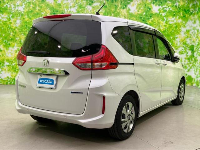 フリードハイブリッド ハイブリッドＧ　保証書／純正　９インチ　ＳＤナビ／フリップダウンモニター　純正　１５．６インチ／両側電動スライドドア／シートヒーター　運転席／ヘッドランプ　ＬＥＤ／Ｂｌｕｅｔｏｏｔｈ接続／ＨＤＭＩ接続／ＥＴＣ　記録簿（3枚目）