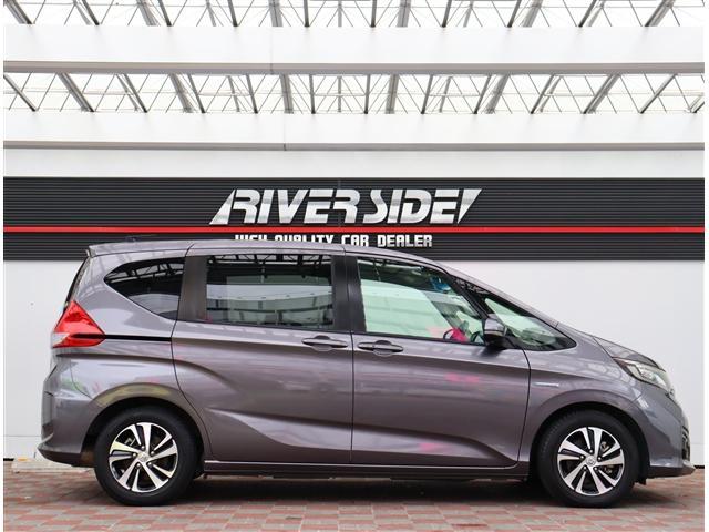 フリードハイブリッド ハイブリッド・Ｇホンダセンシング　純正９インチメモリーナビフルセグバックカメラスマートキーエアロバンパー純正１５インチアルミＬＥＤヘッドライト＆フォグ両側電動スライドステアリモコンレーダークルコンハーフレザーシートホンダセンシング（5枚目）