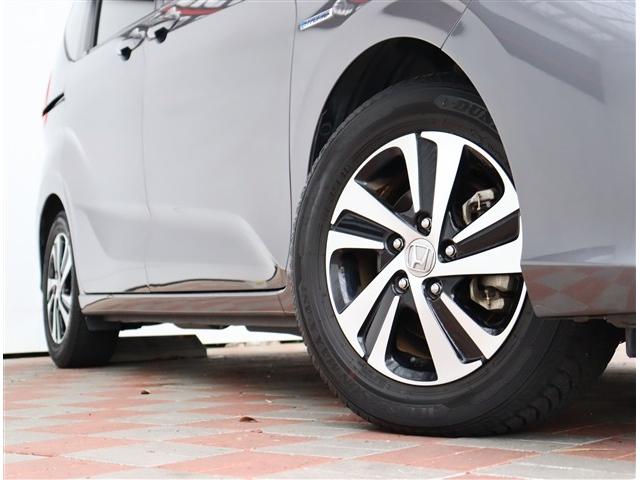 フリードハイブリッド ハイブリッド・Ｇホンダセンシング　純正９インチメモリーナビフルセグバックカメラスマートキーエアロバンパー純正１５インチアルミＬＥＤヘッドライト＆フォグ両側電動スライドステアリモコンレーダークルコンハーフレザーシートホンダセンシング（28枚目）