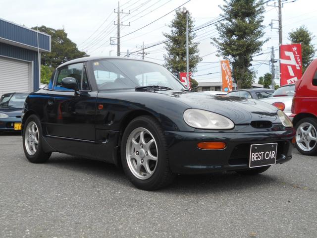 カプチーノ ベースグレード　ツインカムターボ　５速マニュアル　ノーマル車　純正１４インチアルミ　スズキスポーツマフラー　４ＷＡＹオープンカー　ＣＤオーディオ　木目調パネル　ダーククラシックジェイドパール（2枚目）