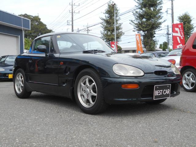 カプチーノ ベースグレード　ツインカムターボ　５速マニュアル　ノーマル車　純正１４インチアルミ　スズキスポーツマフラー　４ＷＡＹオープンカー　ＣＤオーディオ　木目調パネル　ダーククラシックジェイドパール（52枚目）