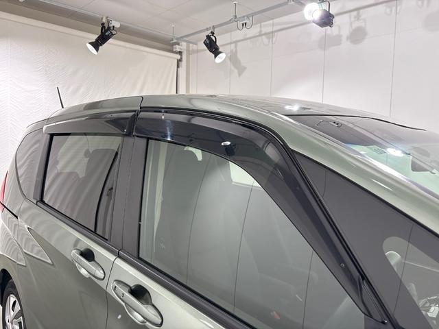 フリードハイブリッド ハイブリッド・Ｇホンダセンシング　ワンオーナー　禁煙車　純正９インチナビ　フルセグテレビ　Ｂｌｕｅｔｏｏｔｈ　ミュージックサーバー　ＵＳＢ　リア席モニター　前後ドラレコ　ＥＴＣ　両側電動スライドドア　シートヒーター　ＬＥＤヘッドライト（30枚目）