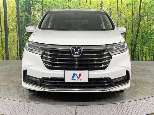 オデッセイハイブリッド ｅ：ＨＥＶアブソルート・ＥＸ　禁煙車　純正１０型ナビ　後席モニター　全周囲カメラ　両側電動スライドドア　ホンダセンシング　アダプティブクルーズ　ＥＴＣ２．０　ドラレコ　シートヒーター　電動リアゲート　ＬＥＤヘッド　１００Ｖ電源（15枚目）