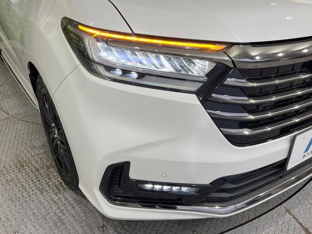 オデッセイハイブリッド ｅ：ＨＥＶアブソルート・ＥＸ　禁煙車　純正１０型ナビ　全周囲カメラ　黒革シート　両側電動スライドドア　ホンダセンシング　アダプティブクルーズ　ＥＴＣ２．０　ドラレコ　シートヒーター　電動リアゲート　ＬＥＤヘッドライト　１００Ｖ電源（13枚目）