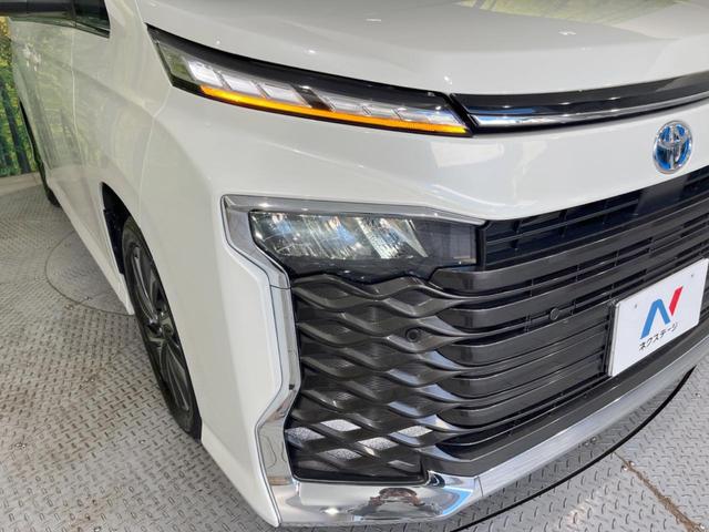 ヴォクシー ハイブリッドＳ－Ｚ　後席モニター　快適利便パッケージｈｉｇｈ　純正１０．５型ＤＡプラス　バックカメラ　ＢＳＭ　両側電動スライドドア　セーフティセンス　レーダークルーズ　電動リアゲート　禁煙車　前席中列シートヒーター（13枚目）