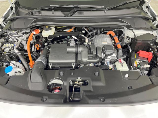 ヴェゼル ｅ：ＨＥＶ　Ｚ　登録済未使用車　メーカー９型ナビ　全周囲カメラ　プレミアムオーディオ　ホンダセンシング　アダプティブクルーズ　ＥＴＣ２．０　フルセグ　ワイヤレス充電　ハーフレザーシート　ハンズフリーパワーバックドア（18枚目）