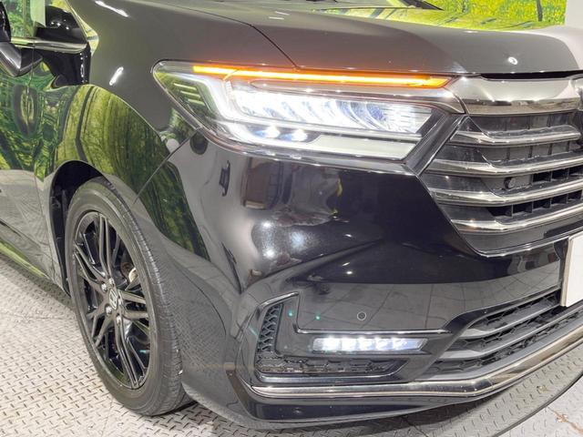 オデッセイハイブリッド e:HEVアブソルート・EX 後席モニター 純正10型ナビ 全周囲カメラ 両側電動スライドドア 100V電源 ホンダセンシング BSM 禁煙車 電動リアゲート ハーフレザーシート シートヒーター パワーシート 前後ドラレコ(13枚目)