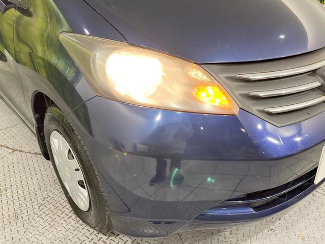 フリード Ｇ　Ｌパッケージ　後席モニター　メーカーＨＤＤナビ　バックカメラ　禁煙車　ＥＴＣ　オートエアコン　ＣＤ／ＤＶＤ再生　地デジＴＶ　ステアリングスイッチ　７人乗り　ウインカーミラー　２列目キャプテンシート（14枚目）