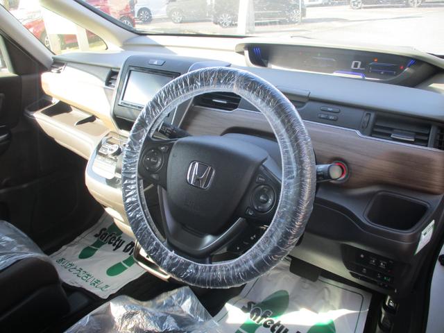 フリードハイブリッド ハイブリッド・Ｇホンダセンシング　バックカメラ　ＥＴＣ　衝突被害軽減ブレーキ　３列シート　両側電動スライドドア　純正ナビ　盗難防止装置　前後ドライブレコーダー（3枚目）